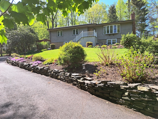 2780 Meriden Waterbury Tpke, Southington, CT 06444 - view of front of house featuring stairs, a front yard, and a chimney