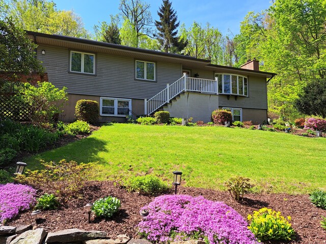2780 Meriden Waterbury Tpke, Southington, CT 06444 - view of front of home featuring stairway, a chimney, and a front yard