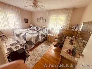 2780 Meriden Waterbury Tpke, Southington, CT 06444 - bedroom featuring multiple windows, wood finished floors, and a ceiling fan