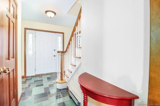 foyer entrance featuring tile patterned floors, stairway, and baseboard heating