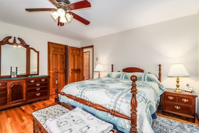bedroom with ceiling fan and light wood-type flooring