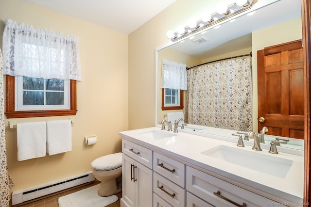 bathroom featuring toilet, a baseboard heating unit, a sink, and visible vents
