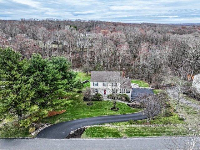 drone / aerial view featuring a view of trees