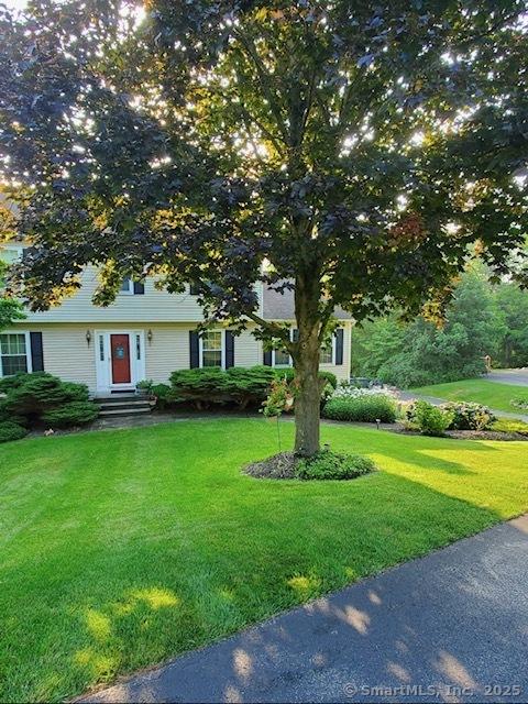 view of front of home with a front yard