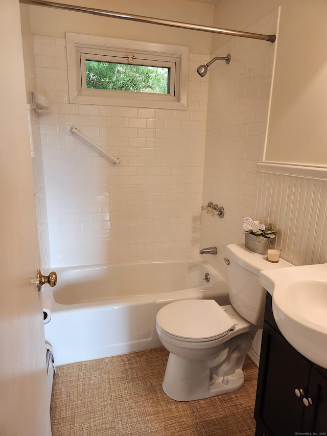 bathroom with toilet, washtub / shower combination, and vanity