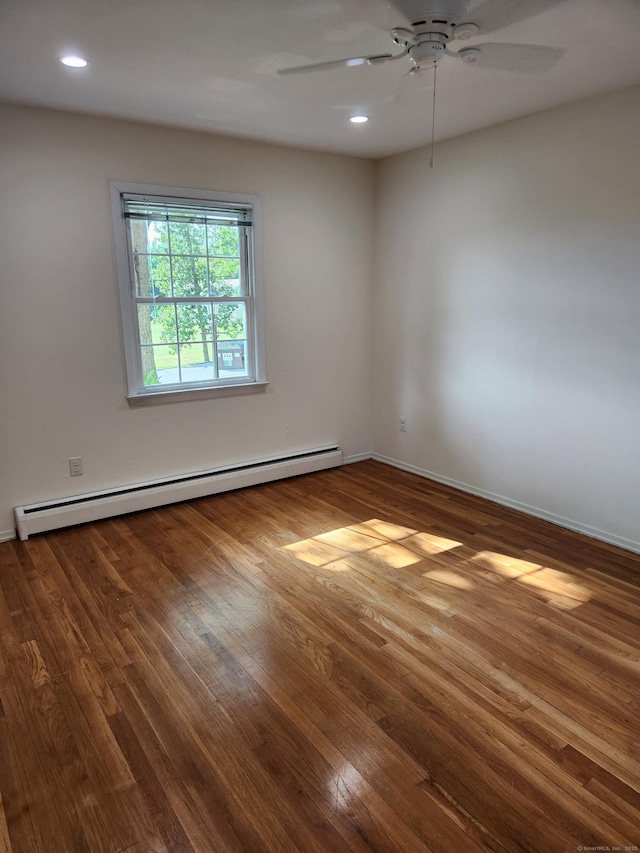 unfurnished room featuring a baseboard radiator, ceiling fan, wood finished floors, recessed lighting, and baseboards