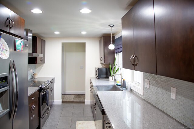 5 Shannon Rdg, Danbury, CT 06810 - kitchen featuring decorative backsplash, wall chimney range hood, dark brown cabinets, and stainless steel appliances