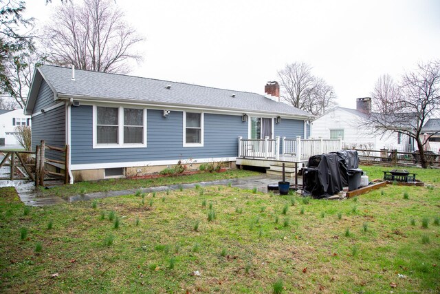 5 Shannon Rdg, Danbury, CT 06810 - back of house featuring a yard, fence, a deck, and a chimney