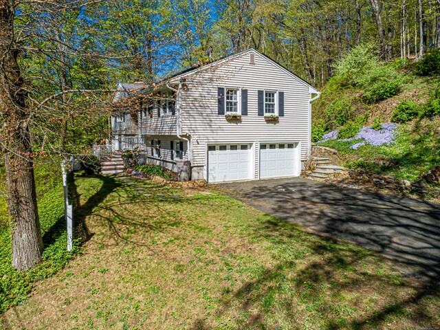 173 Barlow Mountain Rd, Ridgefield, CT 06877 - view of front of property with an attached garage and driveway