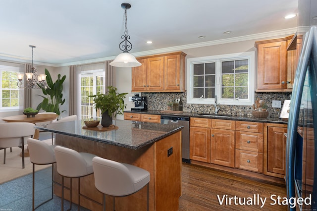 173 Barlow Mountain Rd, Ridgefield, CT 06877 - kitchen with stainless steel appliances, plenty of natural light, a center island, backsplash, and ornamental molding
