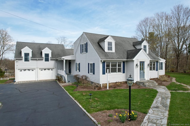 186 Isinglass Rd, Shelton, CT 06484 - cape cod-style house featuring driveway, a shingled roof, a front lawn, and a garage