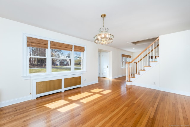 186 Isinglass Rd, Shelton, CT 06484 - interior space featuring baseboards, a notable chandelier, light wood finished floors, and a wealth of natural light