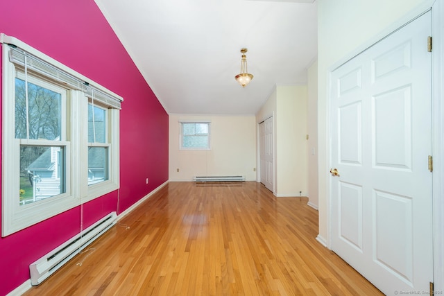 186 Isinglass Rd, Shelton, CT 06484 - additional living space featuring baseboards, light wood-style flooring, and a baseboard heating unit