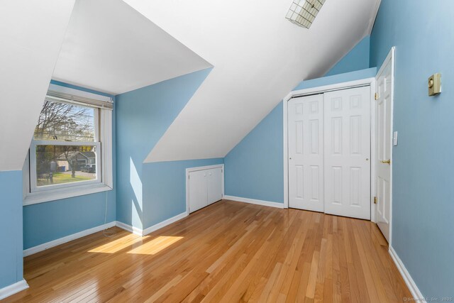 186 Isinglass Rd, Shelton, CT 06484 - bonus room featuring baseboards, vaulted ceiling, and light wood-style floors