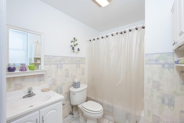 186 Isinglass Rd, Shelton, CT 06484 - bathroom with wainscoting, shower / tub combo with curtain, vanity, toilet, and tile patterned floors