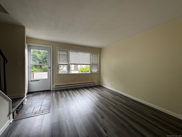 148 Westbury Park Rd Apt D, Watertown, CT 06795 - unfurnished living room featuring a baseboard radiator, dark wood finished floors, stairs, and a textured ceiling