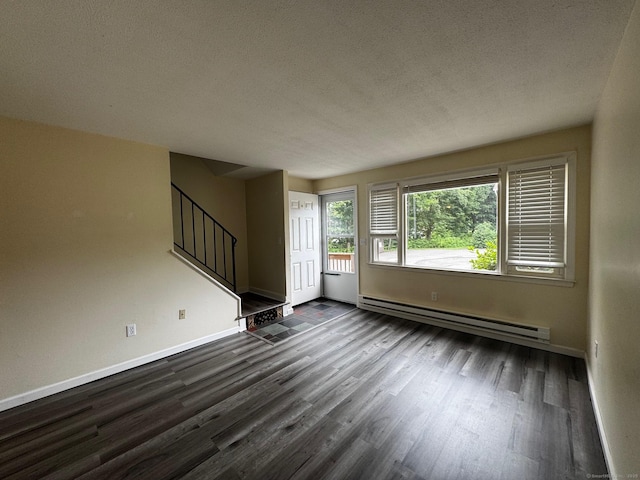 148 Westbury Park Rd Apt D, Watertown, CT 06795 - empty room with baseboard heating, stairs, dark wood-style flooring, and a textured ceiling