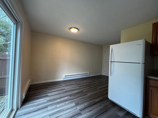 148 Westbury Park Rd Apt D, Watertown, CT 06795 - kitchen featuring freestanding refrigerator, a baseboard radiator, a baseboard heating unit, and dark wood finished floors