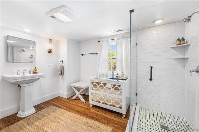 45 Main St, Essex, CT 06442 - bathroom with a shower stall, wood finished floors, baseboards, and visible vents