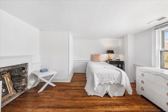 45 Main St, Essex, CT 06442 - bedroom featuring visible vents, wood finished floors, and a fireplace
