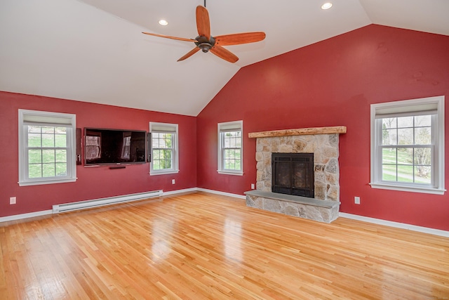 39 Overlook Dr, New Milford, CT 06776 - unfurnished living room featuring plenty of natural light, a baseboard radiator, wood finished floors, and lofted ceiling