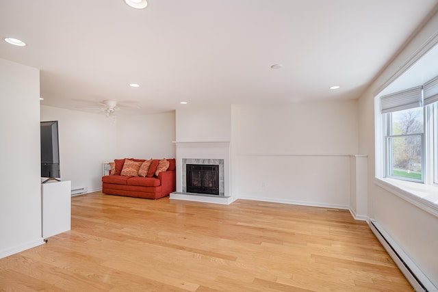 39 Overlook Dr, New Milford, CT 06776 - unfurnished living room featuring a high end fireplace, baseboard heating, and light wood finished floors