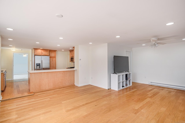 39 Overlook Dr, New Milford, CT 06776 - unfurnished living room featuring ceiling fan, baseboard heating, recessed lighting, and light wood-style flooring