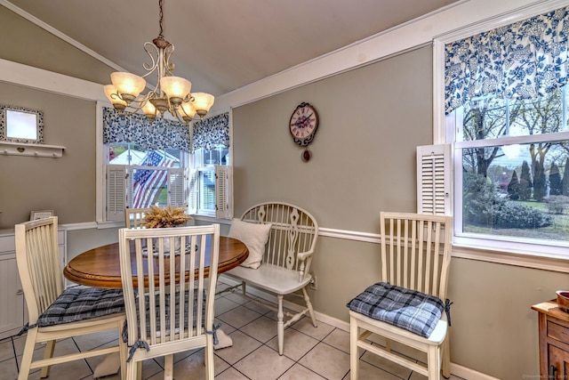 dining area with baseboards, tile patterned flooring, vaulted ceiling, and a chandelier