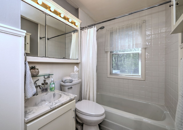 full bath featuring toilet, shower / bathtub combination with curtain, and vanity