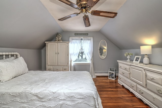 bedroom featuring a ceiling fan, baseboard heating, lofted ceiling, and dark wood-type flooring