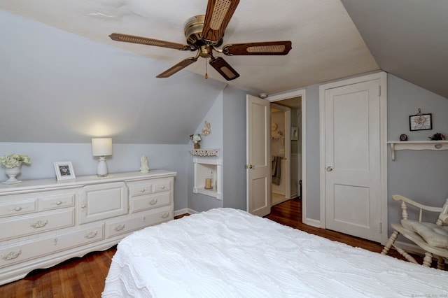 bedroom with baseboards, a ceiling fan, dark wood finished floors, and vaulted ceiling
