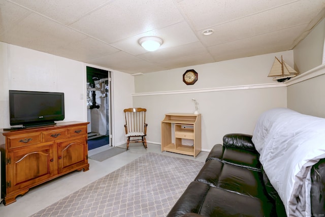 living area featuring a paneled ceiling