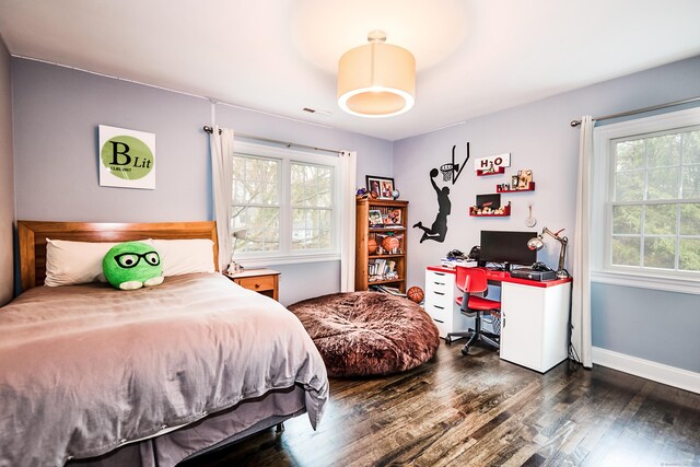 27 Blue Ribbon Dr, Westport, CT 06880 - bedroom with multiple windows, wood finished floors, a desk, and baseboards