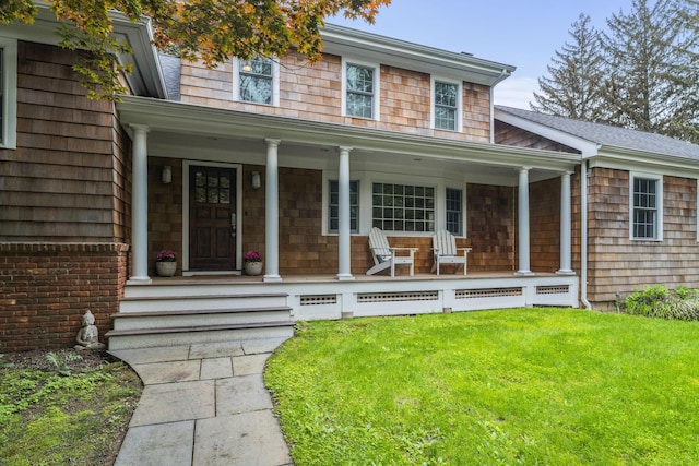 27 Blue Ribbon Dr, Westport, CT 06880 - view of front of property with a porch and a front lawn