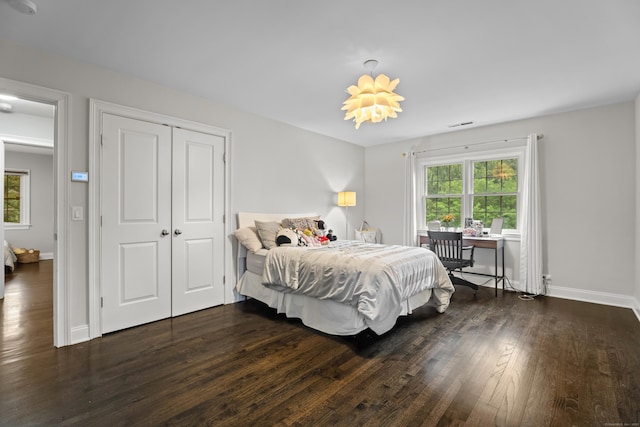 27 Blue Ribbon Dr, Westport, CT 06880 - bedroom with multiple windows, dark wood-type flooring, a closet, and baseboards