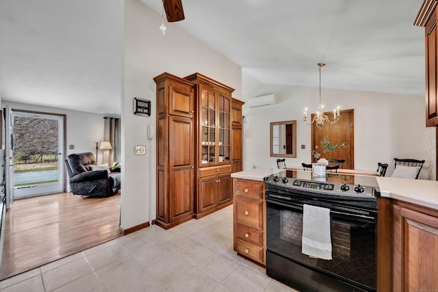 kitchen featuring brown cabinets, a wall mounted air conditioner, lofted ceiling, and black range with electric cooktop