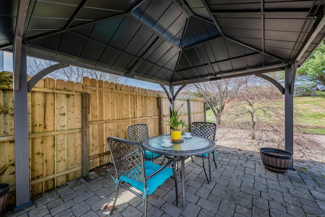 view of patio / terrace with a gazebo and fence