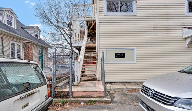 36 Gilbert St, Waterbury, CT 06702 - view of side of home with stairway and fence