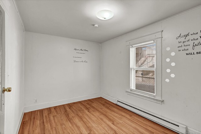 36 Gilbert St, Waterbury, CT 06702 - unfurnished room featuring baseboards, light wood-type flooring, and a baseboard heating unit