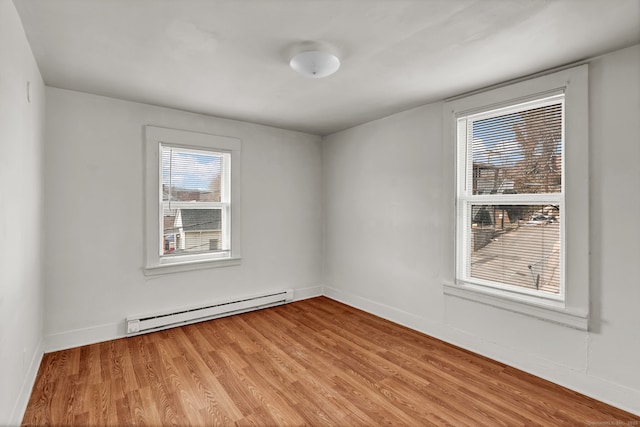 36 Gilbert St, Waterbury, CT 06702 - unfurnished room featuring baseboard heating, baseboards, and light wood-style flooring