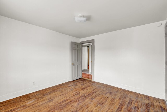 36 Gilbert St, Waterbury, CT 06702 - spare room featuring baseboards and hardwood / wood-style flooring