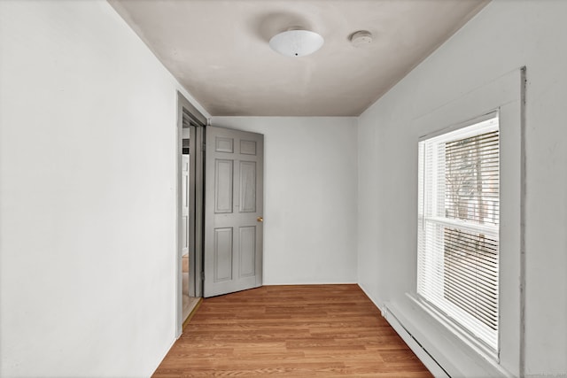 36 Gilbert St, Waterbury, CT 06702 - interior space featuring a baseboard heating unit and light wood-type flooring