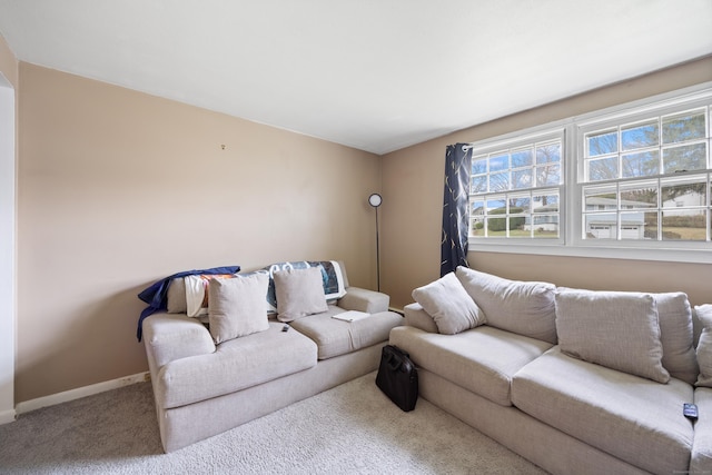 living area with carpet flooring and baseboards