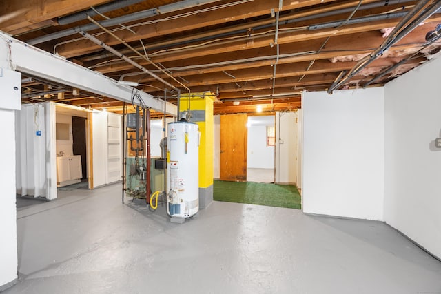 unfinished basement featuring gas water heater