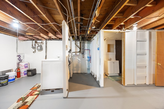 unfinished basement with washer / dryer