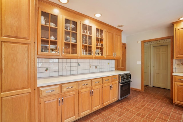 97 Wyldewood Rd, Easton, CT 06612 - kitchen featuring oven, brick patterned floors, light countertops, tasteful backsplash, and recessed lighting