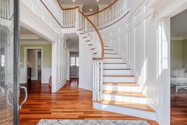 48 Mount Nebo Rd, Newtown, CT 06470 - stairs with ornamental molding, wood finished floors, a decorative wall, recessed lighting, and wainscoting