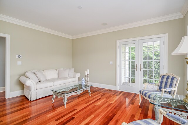 48 Mount Nebo Rd, Newtown, CT 06470 - living room with crown molding, wood finished floors, baseboards, and french doors