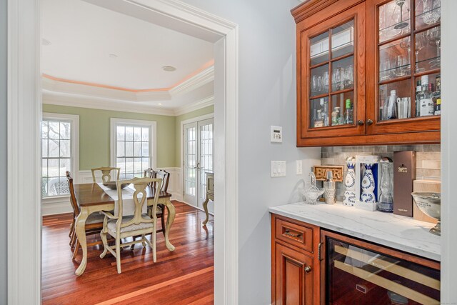 48 Mount Nebo Rd, Newtown, CT 06470 - indoor dry bar with wine cooler, ornamental molding, dark wood-type flooring, wainscoting, and a raised ceiling
