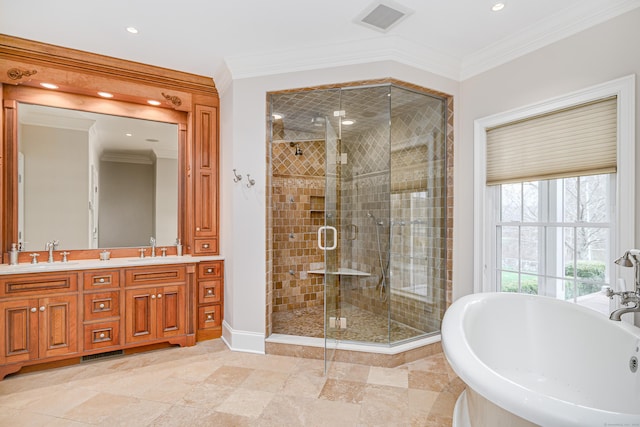 48 Mount Nebo Rd, Newtown, CT 06470 - bathroom with a freestanding tub, double vanity, a stall shower, recessed lighting, and crown molding